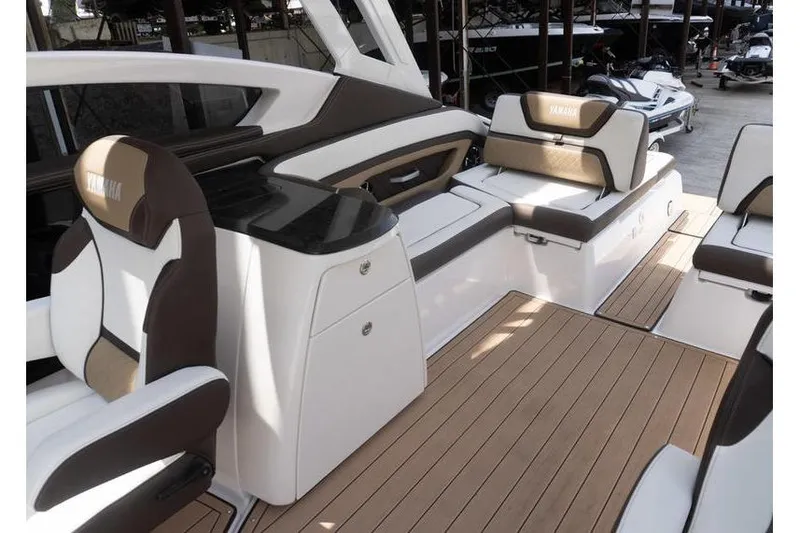 Slide: The Image of 2023 Yamaha Boats 275SDX interior with luxurious seating and sleek design. - 25