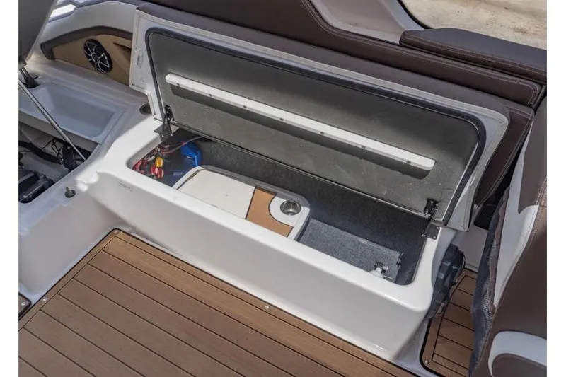 Slide: The Image of Open storage compartment on 2023 Yamaha Boats 275SDX, featuring spacious interior and sleek design. - 33