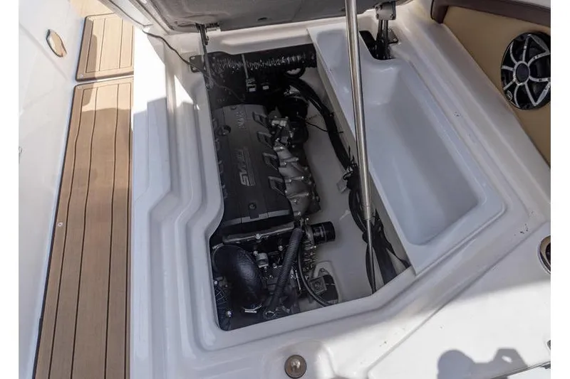 Slide: The Image of 2023 Yamaha Boats 275SDX engine compartment with visible components and sleek design. - 34