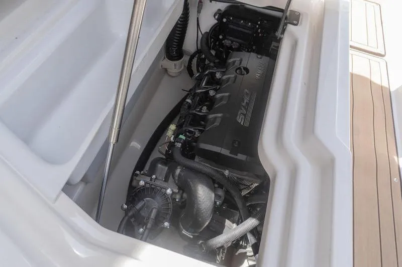 Slide: The Image of Engine compartment of 2023 Yamaha Boats 275SDX, showcasing sleek design and advanced technology. - 35