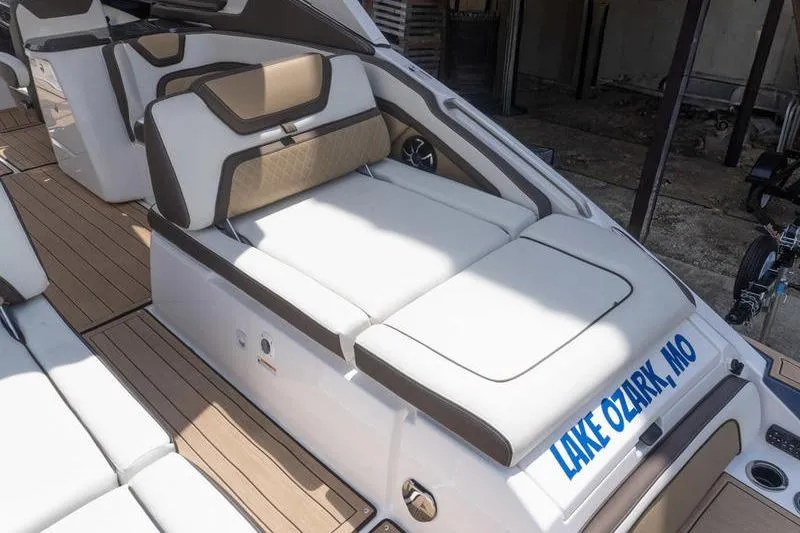 Slide: The Image of 2023 Yamaha Boats 275SDX interior with cushioned seating, Lake Ozark, MO. - 5