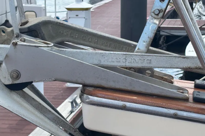 Slide: The Image of Close-up of a 1999 Island Packet 45 boat anchor mechanism at a dock. - 30