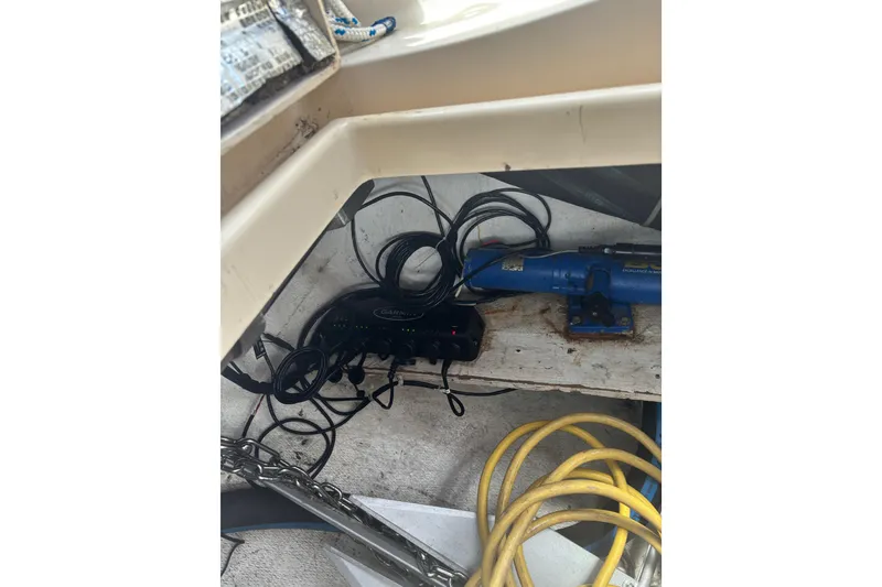 Slide: The Image of Storage area on a 1999 Island Packet 45 sailboat with cables and equipment. - 33