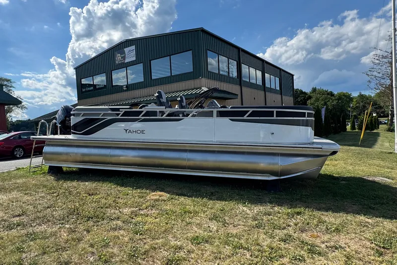 Slide: The Image of 2026 Tahoe Pontoon Sport 85 Quad Lounger 23 displayed outdoors on grass. - 1