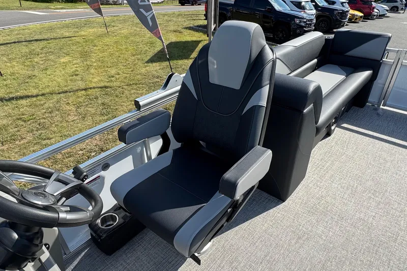 Slide: The Image of 2026 Tahoe Pontoon Sport 85 Quad Lounger 23 interior with sleek captain's chair and lounge seating. - 9