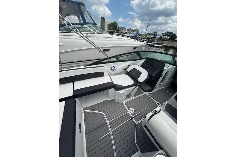 Slide: The Image of 2023 Monterey M-45 boat interior with sleek seating and modern design at a marina. - 3