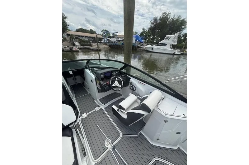 Slide: The Image of 2023 Monterey M-45 boat interior with sleek design, docked near other boats. - 4