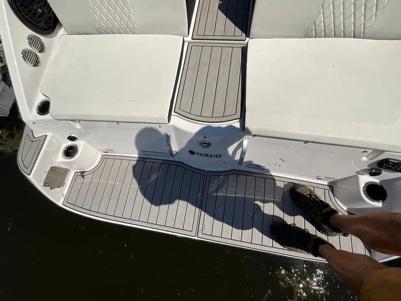 Slide: The Image of The image shows the stern of a Yamaha 222SD boat with gray decking. - 19
