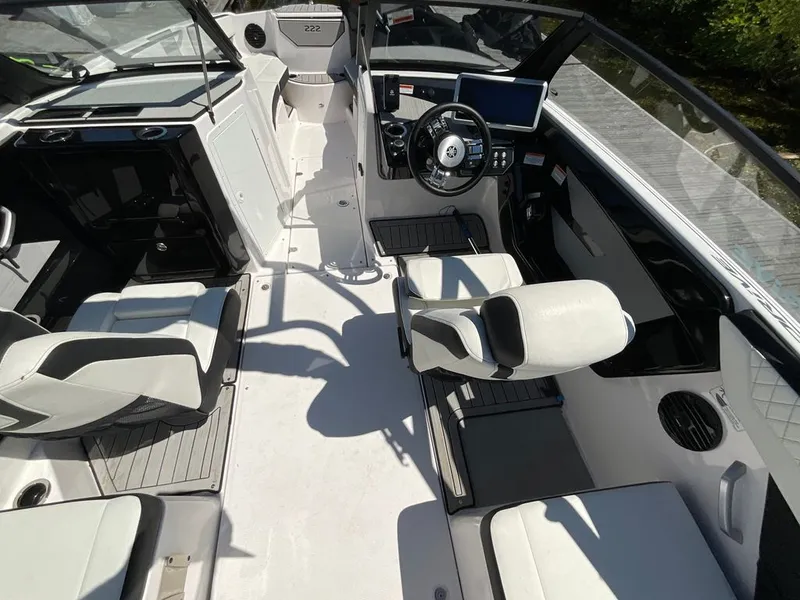 Slide: The Image of The image shows the cockpit of a Yamaha 222SD boat with modern seating and a helm station. - 8