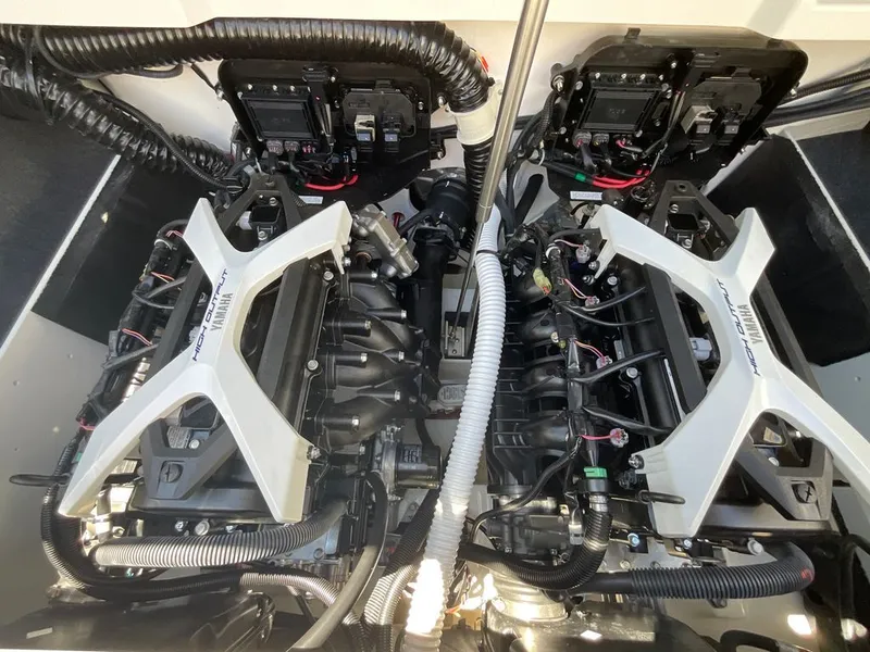 Slide: The Image of The engine compartment of a Yamaha 222SD boat with two powerful engines and complex wiring. - 16