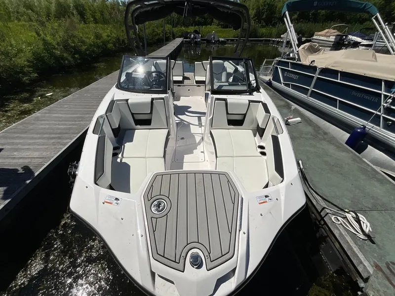 Slide: The Image of A modern Yamaha boat, model 222SD, docked. It features a stylish, open cabin. - 3