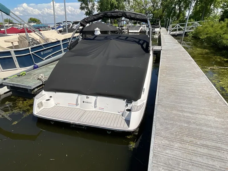Slide: The Image of 2025 Yamaha 222SD docked with a black cover. - 22