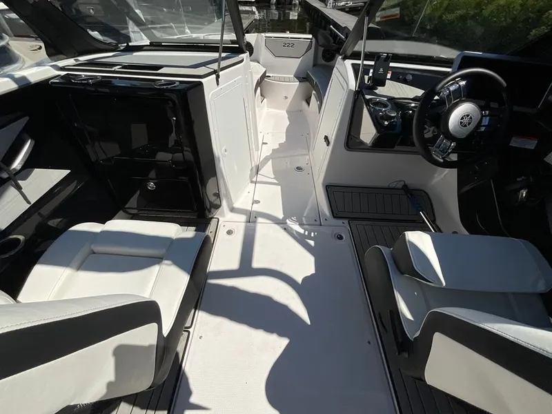 Slide: The Image of Interior of a modern boat with white seats and a black steering wheel. - 7