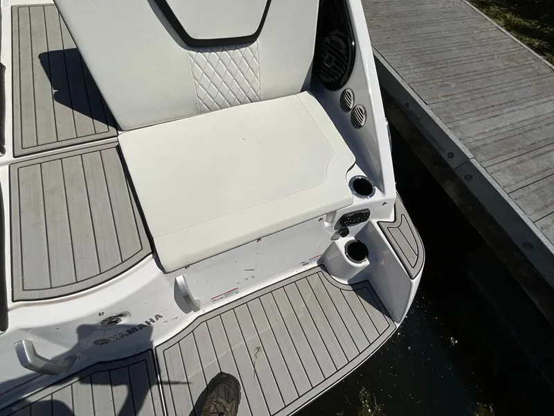 Slide: The Image of The image shows the stern of a Yamaha 222SD boat with gray and white upholstery. - 20