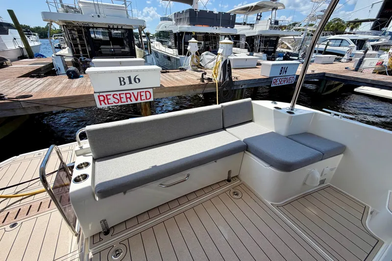 Slide: The Image of 2025 Beneteau Swift Trawler 41 Fly, docked with reserved seating area, marina view. - 16