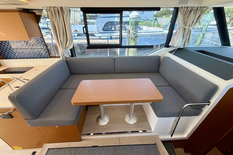 Slide: The Image of Interior of 2025 Beneteau Swift Trawler 41 Fly with cozy seating and table. - 22