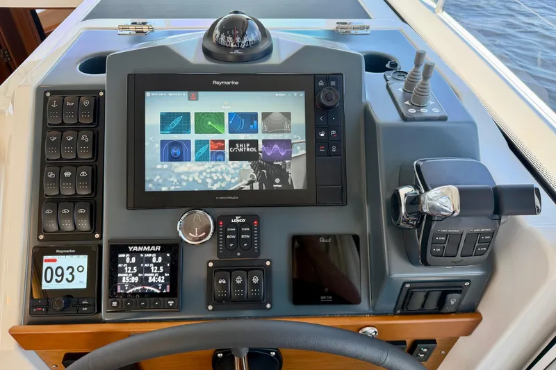 Slide: The Image of 2025 Beneteau Swift Trawler 41 Fly helm with advanced navigation and control systems. - 23