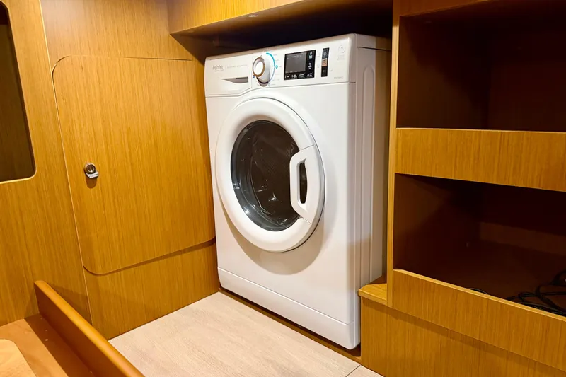 Slide: The Image of Laundry area in 2025 Beneteau Swift Trawler 41 Fly with washing machine. - 32