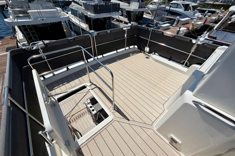 Slide: The Image of Flybridge of 2025 Beneteau Swift Trawler 41 Fly, featuring spacious deck and railing. - 12