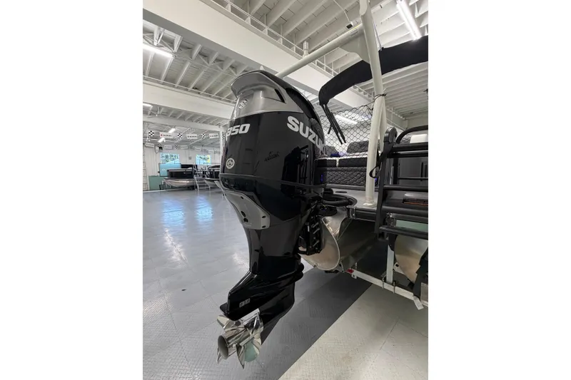Slide: The Image of 2026 South Bay 525SB2 boat with Suzuki 350 outboard motor in showroom. - 12