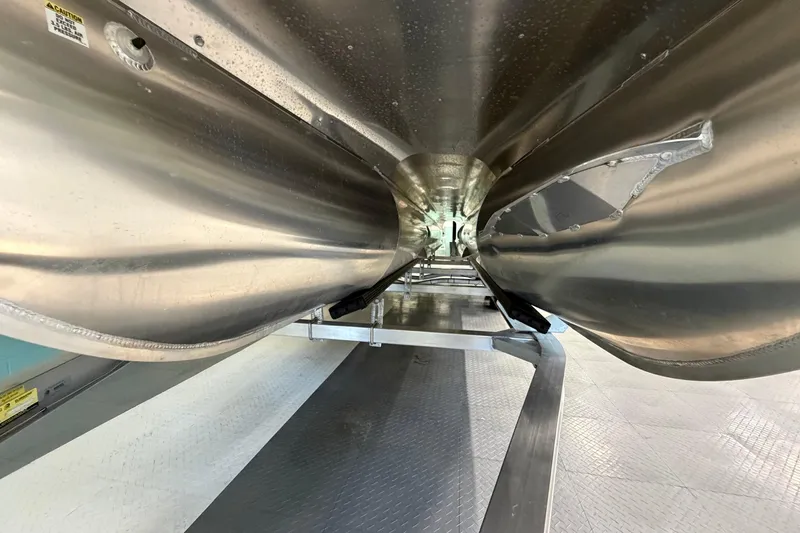 Slide: The Image of Underneath view of 2026 South Bay 525SB2 pontoon boat, showcasing sleek aluminum construction. - 16
