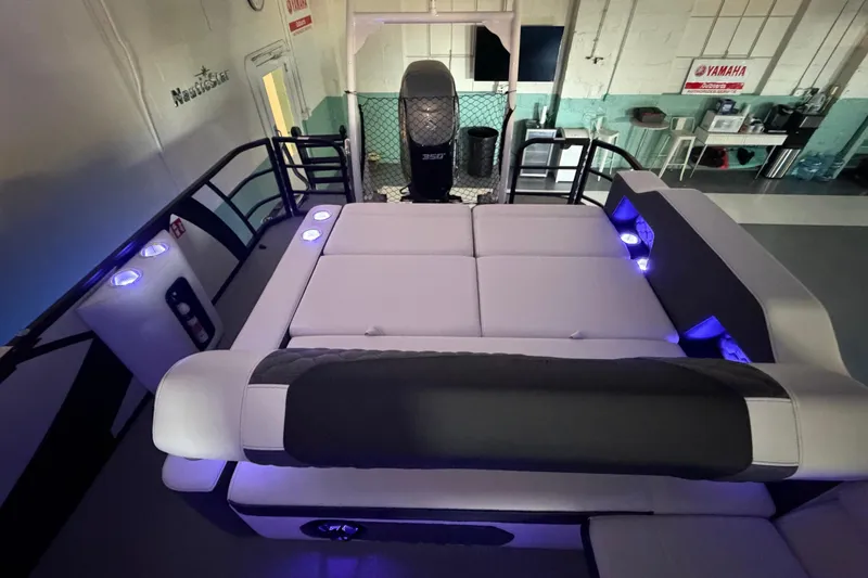 Slide: The Image of Luxurious interior of 2026 South Bay 525SB2 pontoon boat with ambient lighting. - 22