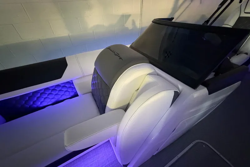Slide: The Image of Luxurious interior of 2026 South Bay 525SB2 boat with ambient lighting and plush seating. - 30