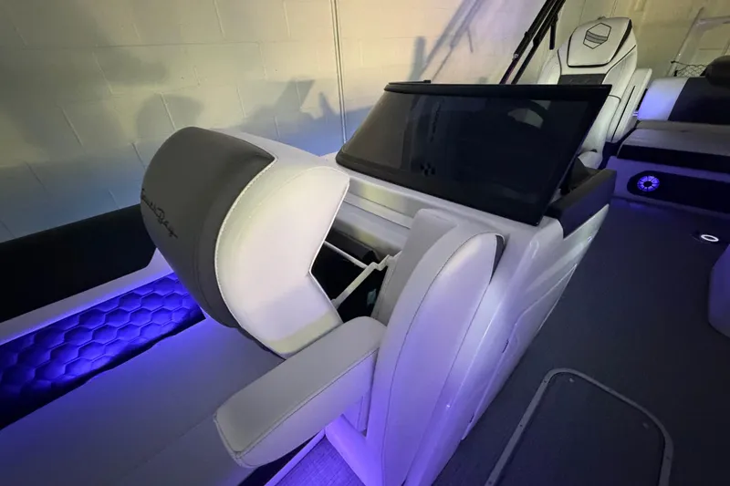 Slide: The Image of Luxurious interior of 2026 South Bay 525SB2 boat with ambient lighting and modern seating. - 31