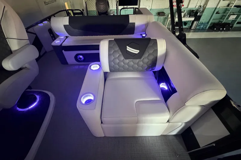 Slide: The Image of Luxurious interior of 2026 South Bay 525SB2 boat with illuminated seating and cup holders. - 36