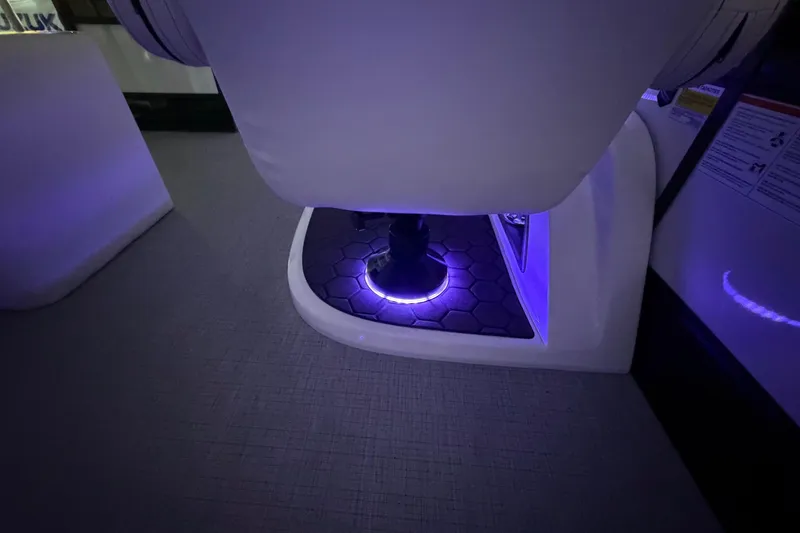 Slide: The Image of LED-lit interior of 2026 South Bay 525SB2 boat, featuring hexagonal flooring. - 37