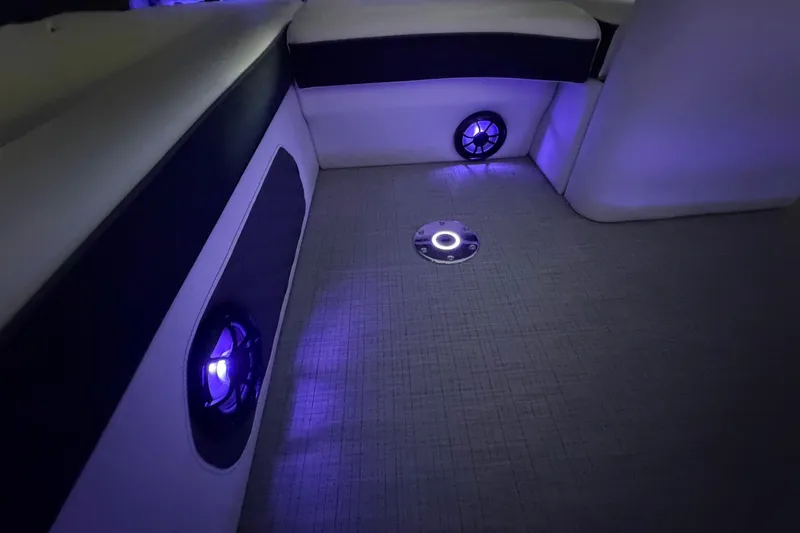 Slide: The Image of Interior of 2026 South Bay 525SB2 boat with ambient blue lighting. - 38