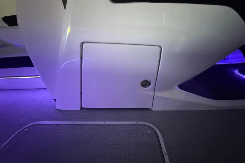Slide: The Image of Interior view of 2026 South Bay 525SB2 boat with ambient purple lighting. - 40