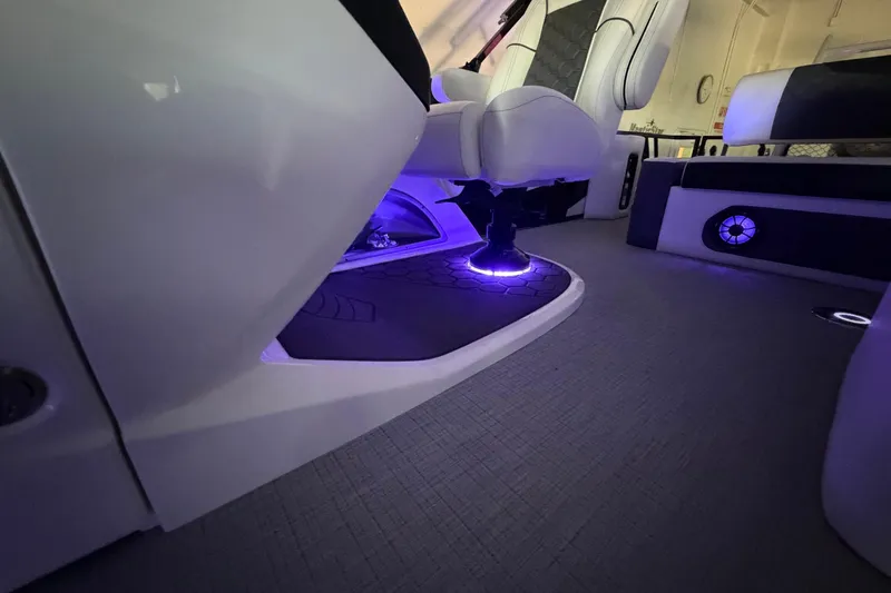 Slide: The Image of Luxurious interior of 2026 South Bay 525SB2 boat with ambient purple lighting. - 41