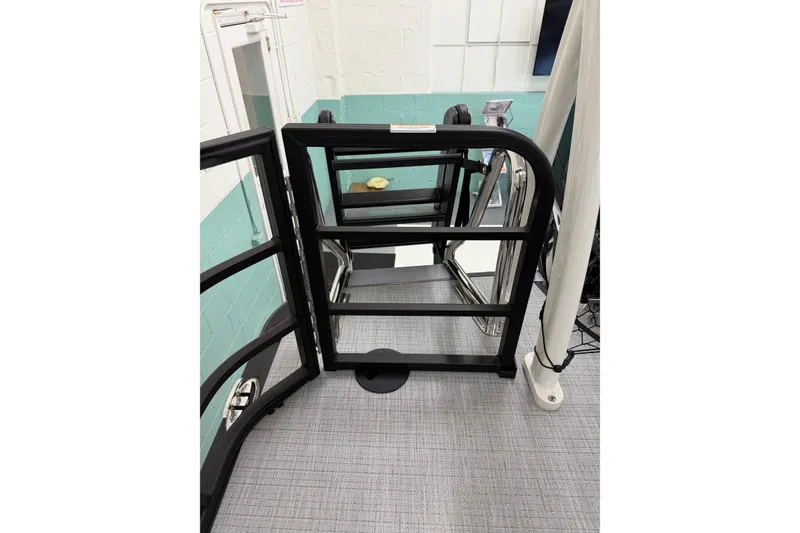 Slide: The Image of 2026 South Bay 525SB2 boat gate with sleek black railing and modern design. - 49