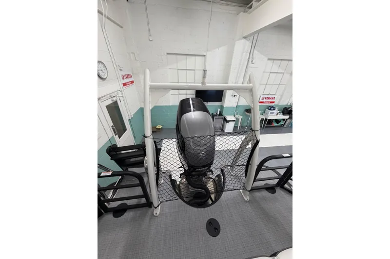Slide: The Image of 2026 South Bay 525SB2 boat with Yamaha engine in a workshop setting. - 50