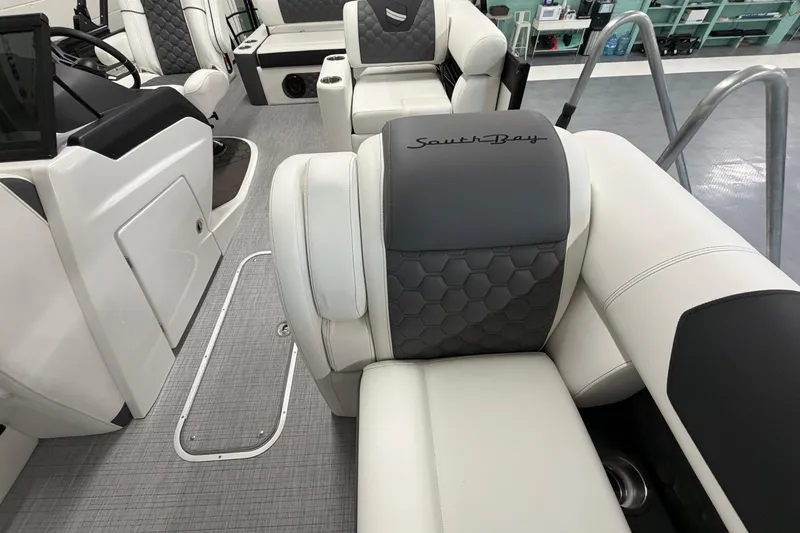 Slide: The Image of Interior of 2026 South Bay 525SB2 boat with luxurious seating and modern design. - 52