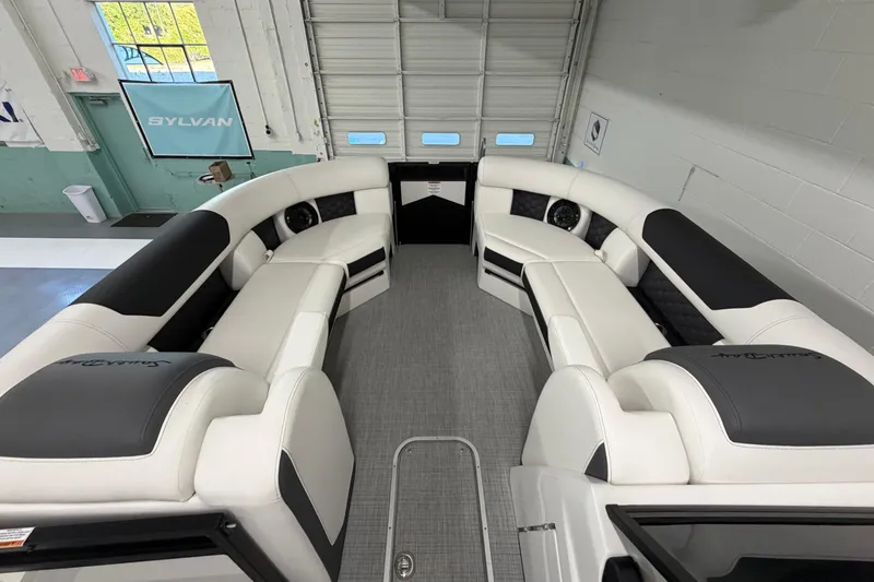 Slide: The Image of Luxurious interior of 2026 South Bay 525SB2 pontoon boat with plush seating. - 55