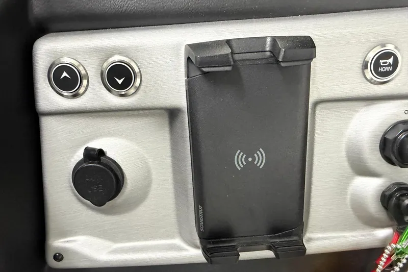 Slide: The Image of Control panel of 2026 South Bay 525SB2 with wireless charging dock and buttons. - 57