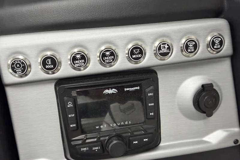 Slide: The Image of Control panel of 2026 South Bay 525SB2 boat with various function buttons and audio system. - 58