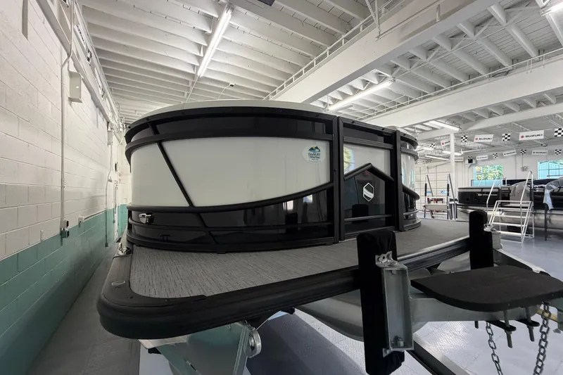 Slide: The Image of 2026 South Bay 525SB2 pontoon boat in a showroom, showcasing sleek design and modern features. - 6