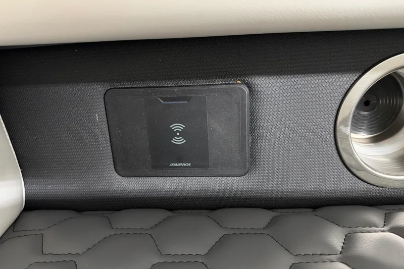 Slide: The Image of Wireless charging pad in 2026 South Bay 525SB2 boat interior, featuring sleek design and cup holder. - 60