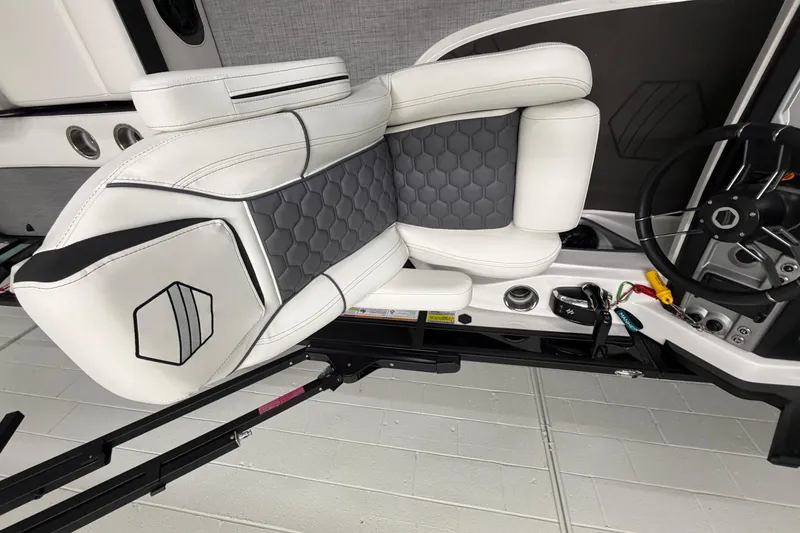 Slide: The Image of Luxurious interior of 2026 South Bay 525SB2 boat with sleek white and gray seating. - 62