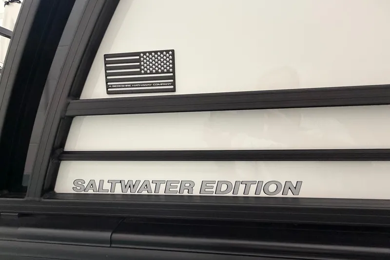Slide: The Image of 2026 South Bay 525SB2 Saltwater Edition with American flag emblem. - 8