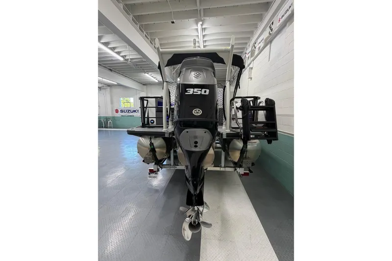 Slide: The Image of 2026 South Bay 525SB2 boat with Suzuki 350 engine in showroom. - 9