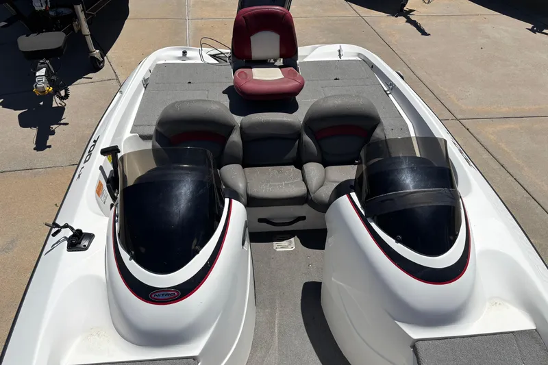 Slide: The Image of 1998 Nitro 700 LX DC boat interior with dual consoles and seating arrangement. - 3