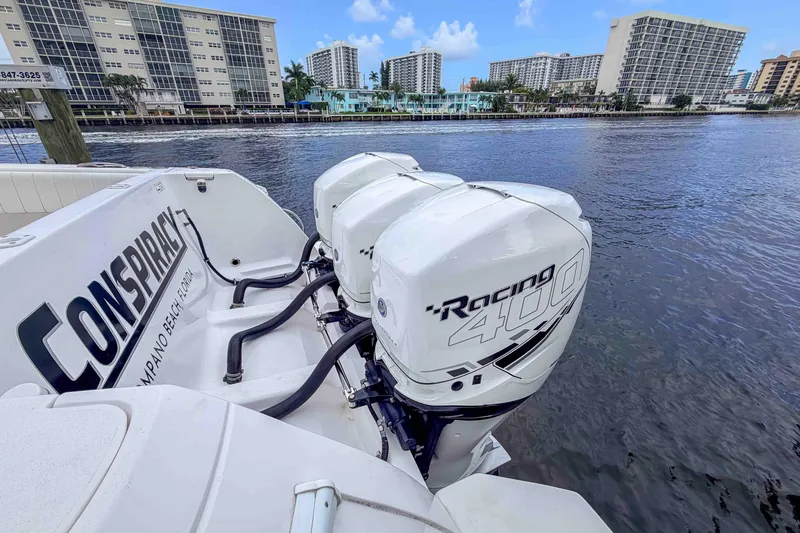 Slide: The Image of 2019 Intrepid 400 Center Console with powerful Racing 400 engines docked by waterfront buildings. - 17