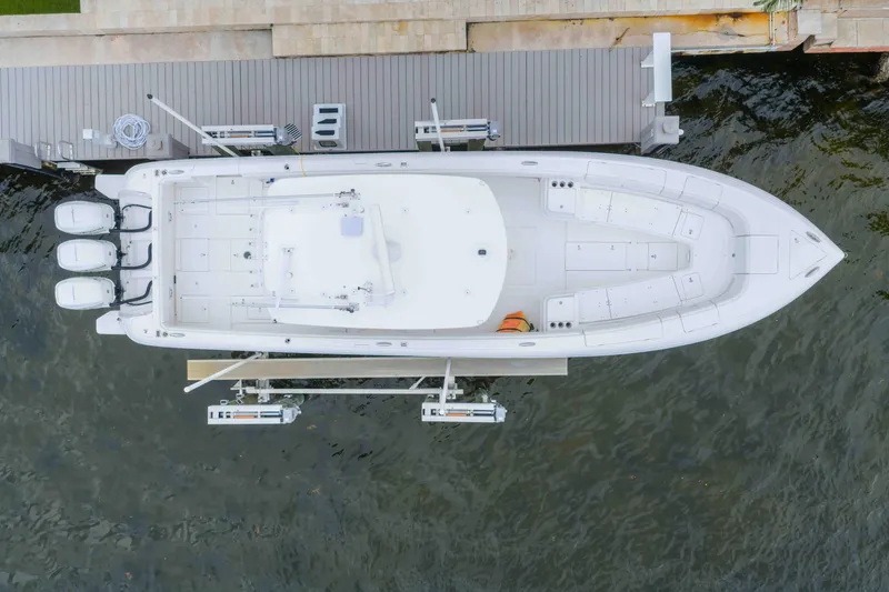 Slide: The Image of Aerial view of 2019 Intrepid 400 Center Console boat docked at a marina. - 13