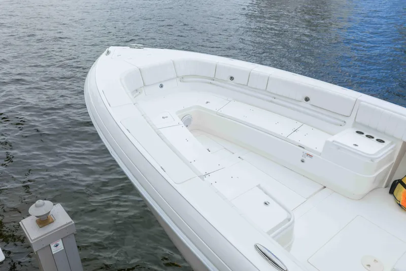 Slide: The Image of 2019 Intrepid 400 Center Console boat docked on calm water. - 16
