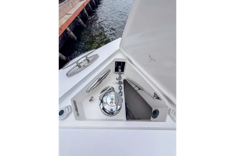Slide: The Image of 2019 Intrepid 400 Center Console anchor locker with chain and cleats, dockside view. - 39