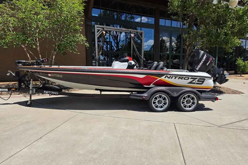 The Image of 2008 Nitro Z-9 boat on trailer, parked outdoors near building. - 0
